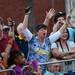 Michigan fan Janice Sanders, of Tampa, cheers for a cameraman before the start of the Outback Bowl New Year's eve parade in Ybor City, Fla. on Monday night. Melanie Maxwell I AnnArbor.com